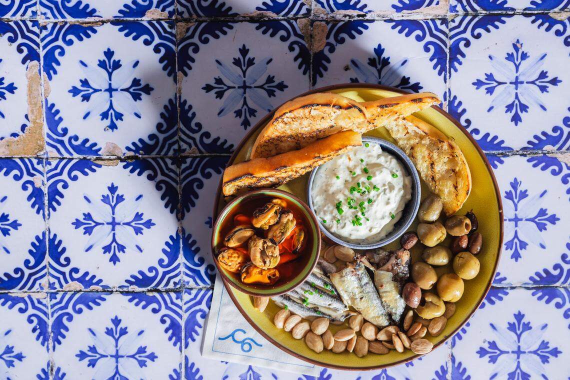 The menu at Chapter 6 includes mezze options such as whipped ricotta and marinated olives.