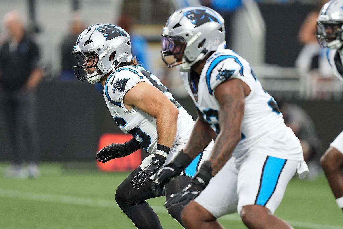 Aug 2, 2025; Charlottle, NC, USA; Carolina Panthers linebacker Christian Rozeboom (56) and linebacker Trevin Wallace (32) during Fanfest at Bank of America Stadium. Mandatory Credit: Jim Dedmon-Imagn Images