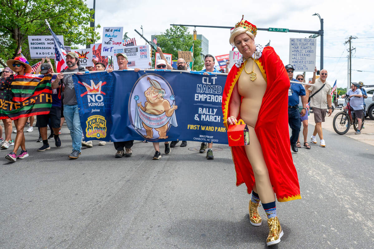 Amanda Hancock leads the No Kings march and rally while dressed like Donald Trump in Charlotte, NC, Saturday, June 14, 2025.