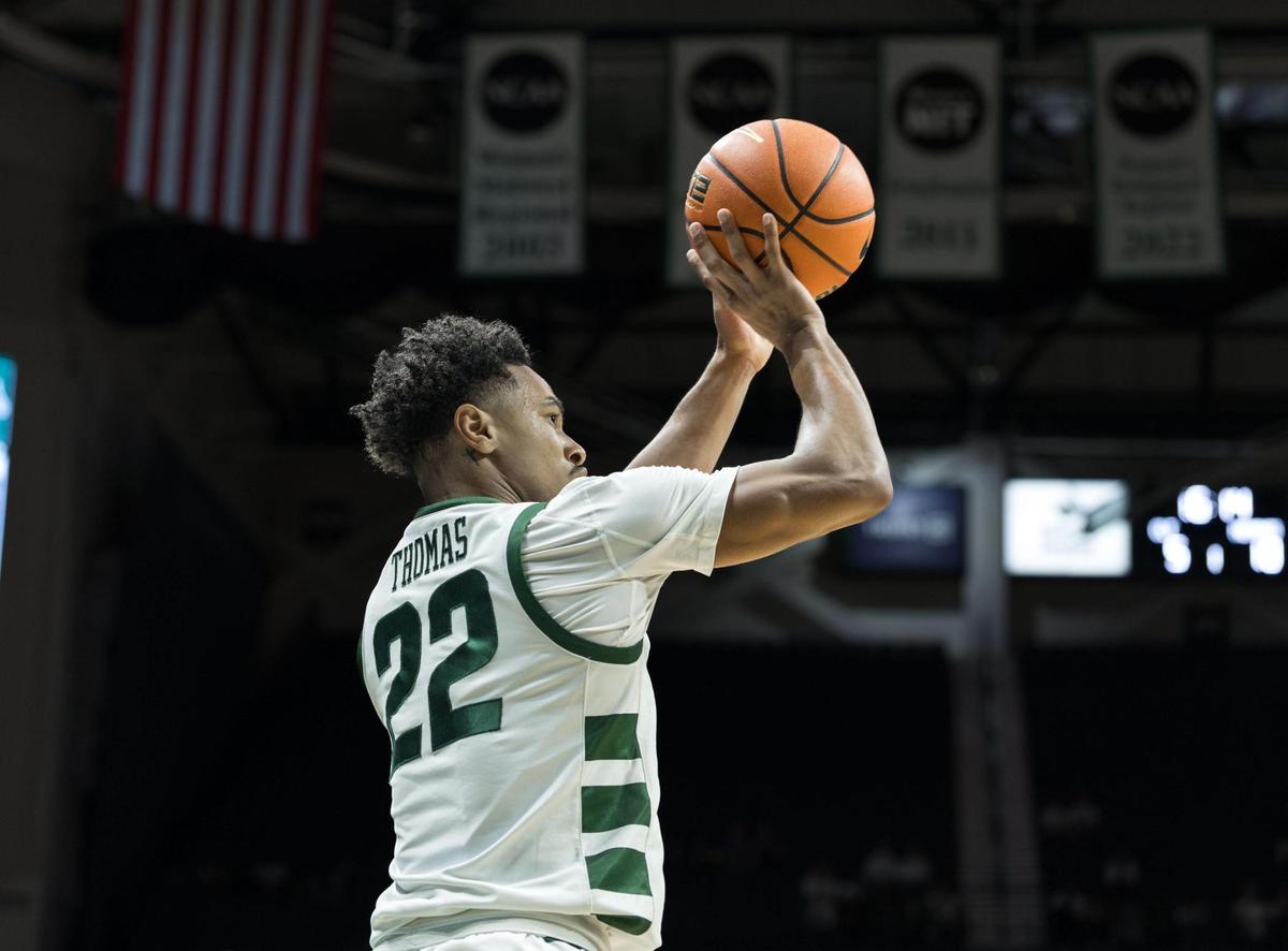 Charlotte Junior guard Jaehshon Thomas (22) pulls up from the baseline and hits the 3-point basket. Charlotte would host the Memphis Tigers in an American Athletic Conference game on January 19, 2025.