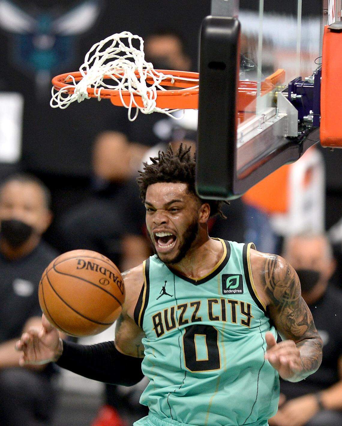 Charlotte Hornets forward Miles Bridges reacts to his two-handed dunk against the Miami Heat on March 26 at Spectrum Center. Bridges has become a vocal leader for the Hornets despite losing his starting position.