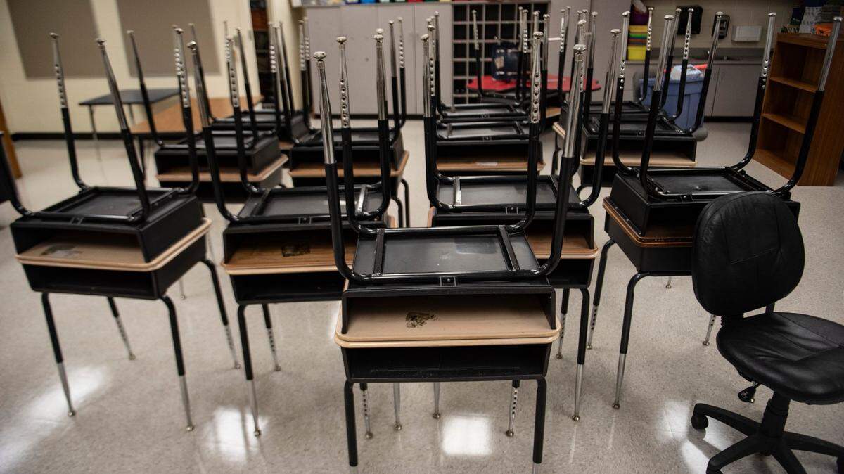 Classroom desks sit unused in a fifth grade classroom at University Park Creative Arts Elementary School near Beatties Ford Road in Charlotte, North Carolina.