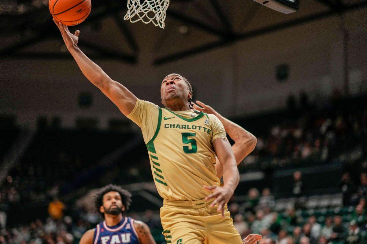 Charlotte 49ers guard Isaiah Folkes (5) goes up for a layup against the Florida Atlantic Owls during a game earlier this month. / Jim Dedmon-USA TODAY Sports