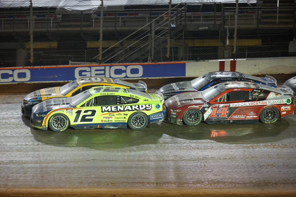 NASCAR Cup Series driver Christopher Bell (20) and NASCAR Cup Series driver Ryan Blaney (12) lead a restart at the Bristol Motor Speedway Dirt Course.