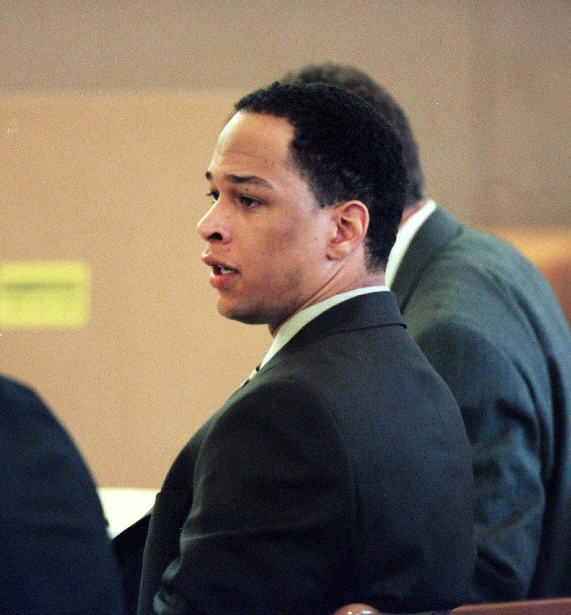 Rae Carruth listens as witness Van Brett Watkins testifies during Carruth’s murder trial. Watkins several times called Carruth a “bitch” during his testimony.