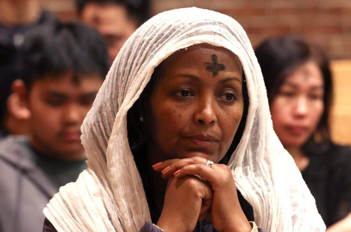 Ashes formed in the cross mark the forehead of a parishioner during an Ash Wednesday Mass at St. John Neumann Catholic Church in Charlotte, NC on Wednesday, February 18, 2026. Bishop Michael Martin is laying out his vision for the church and some of his initial actions have faced scrutiny. 