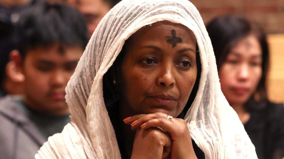 Ashes formed in the cross mark the forehead of a parishioner during an Ash Wednesday Mass at St. John Neumann Catholic Church in Charlotte, NC on Wednesday, February 18, 2026. Bishop Michael Martin is laying out his vision for the church and some of his initial actions have faced scrutiny. 