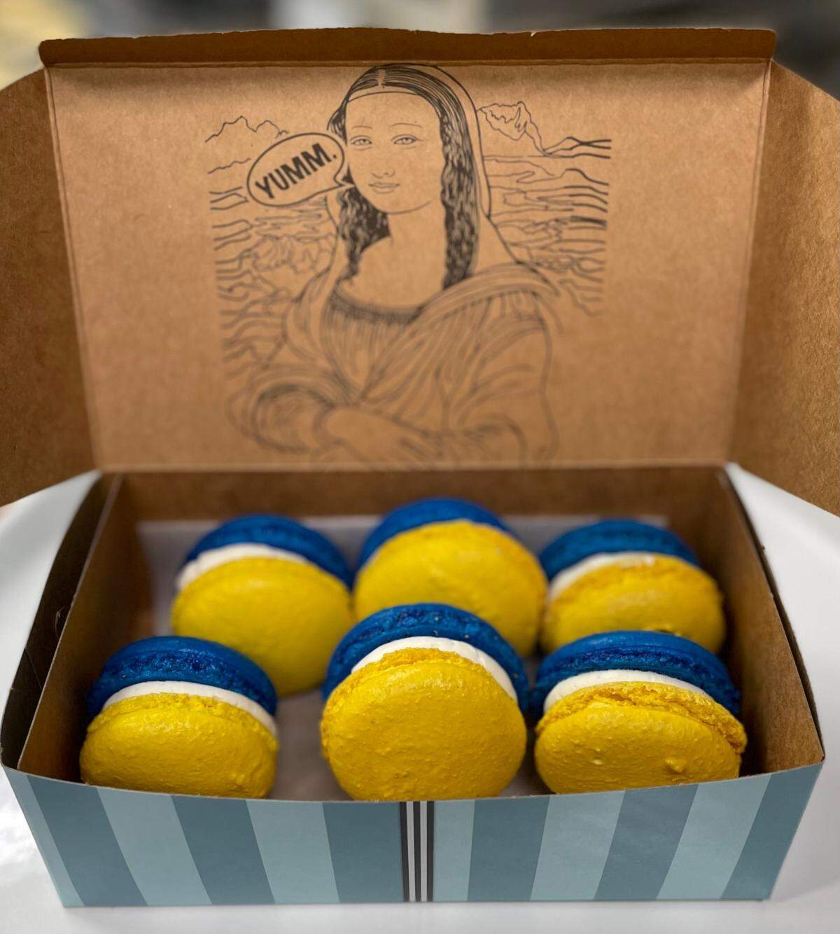 Proceeds from Amelie’s blue and yellow macarons will to go help Ukrainians via the International Committee of the Red Cross.
