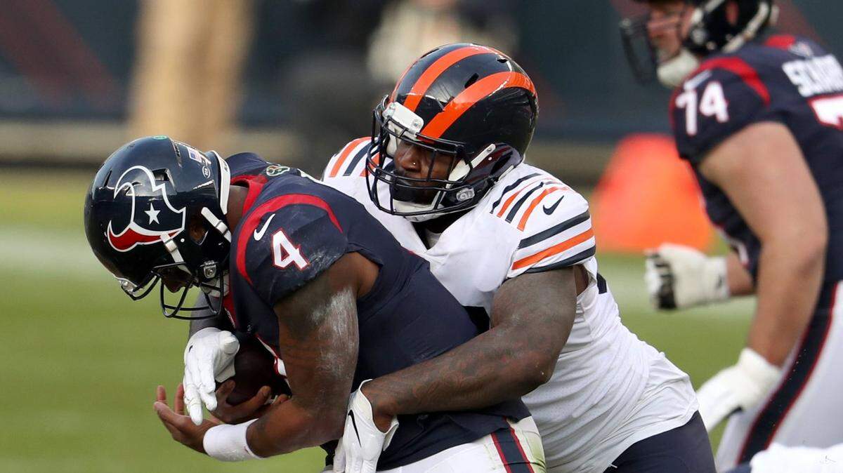 Chicago Bears defensive end Mario Edwards, right, sacks Houston Texans quarterback Deshaun Watson (4) during the third quarter on Sunday, Dec. 13, 2020 at Soldier Field in Chicago. Edwards is accused of assaulting a 28-year-old woman in a Charlotte hotel.