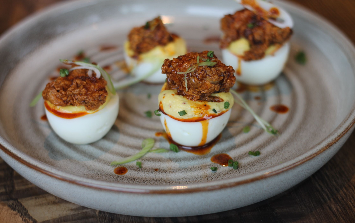 Golden Owl Tavern adds Southern flare to its hot chicken deviled eggs.