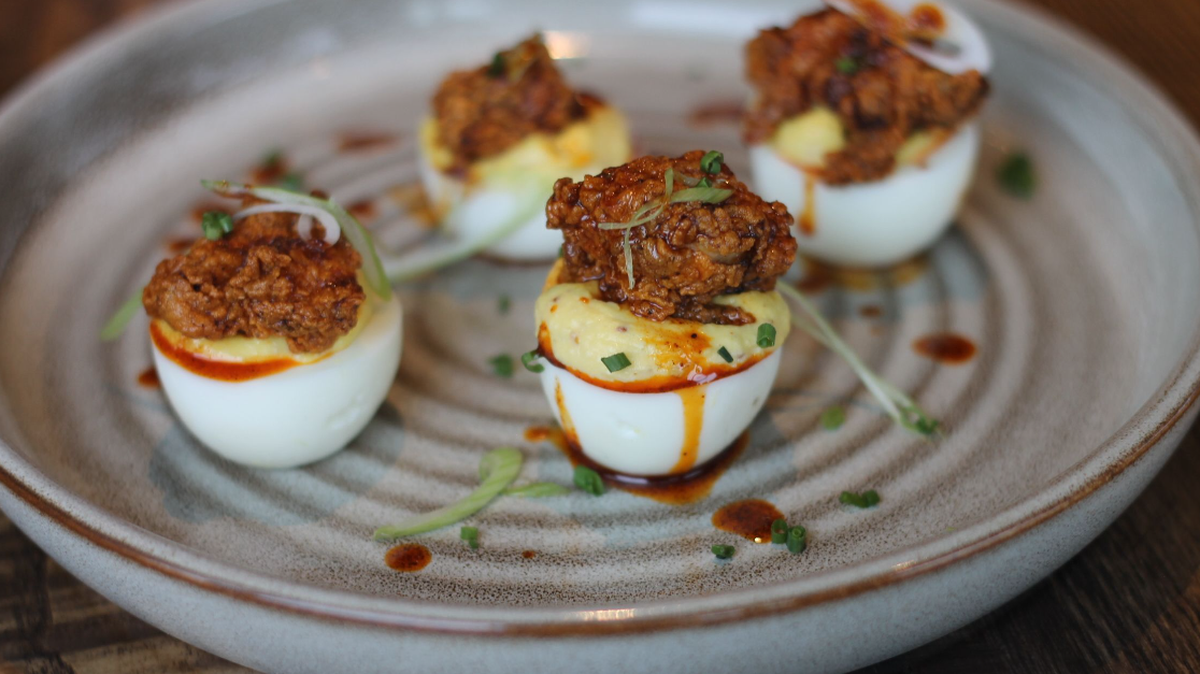 Golden Owl Tavern adds Southern flare to its hot chicken deviled eggs.