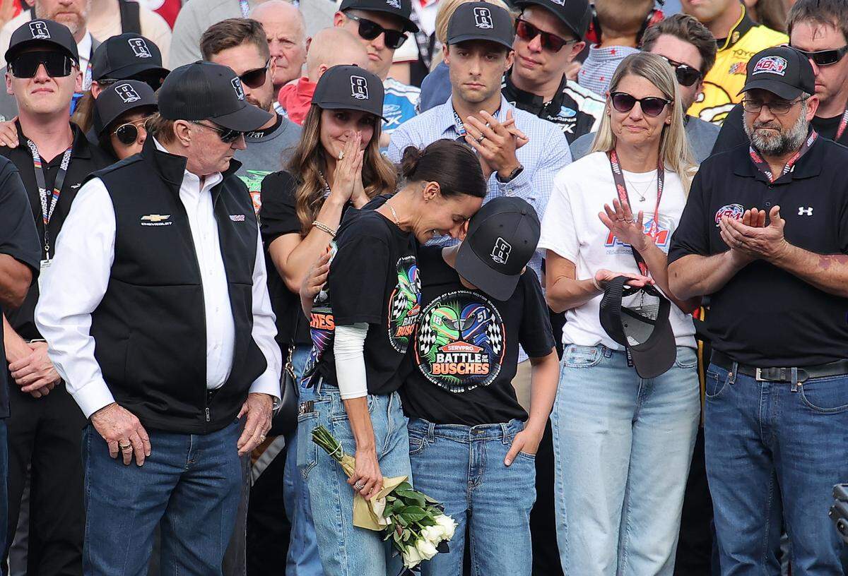 CONCORD, NORTH CAROLINA - MAY 24:  Samantha Busch (wife) and Brexton Busch (son) embrace one another on the grid during the remembrance ceremony for Kyle Busch, who passed away suddenly at the age of 41, prior to the NASCAR Cup Series Coca-Cola 600 at Charlotte Motor Speedway on May 24, 2026 in Concord, North Carolina. (Photo by Jonathan Bachman/Getty Images)