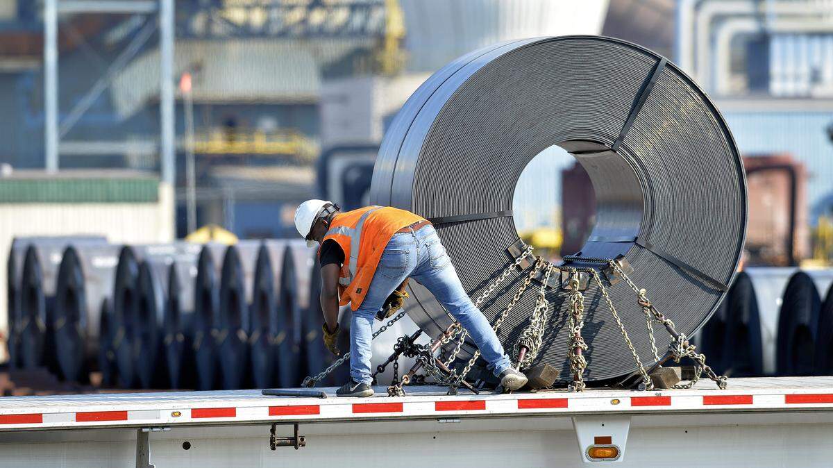 Charlotte-based Nucor on Friday announced the retirement of its chairman and chief executive, John Ferriola, and named a longtime executive as its incoming CEO. A Nucor worker at a Kentucky plant is seen here in this file photo.