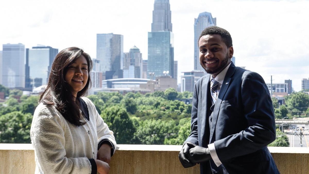 Lizette Gomez (left) and Trinity Simpson (right) are graduates of Year Up Charlotte, a program that works to improve economic mobility in Charlotte through corporate internships that helps young people gain job skills and make social and professional connections.