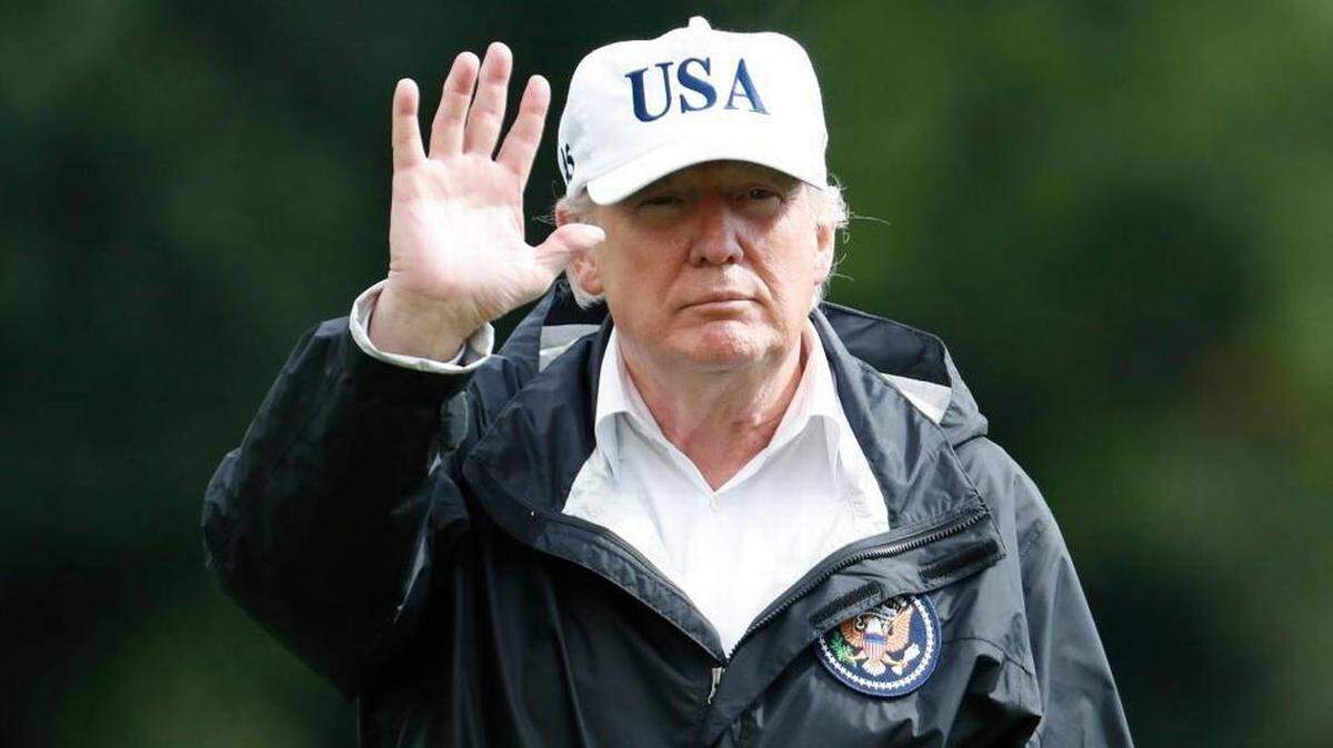 In this 2017 photo, President Donald Trump waves as he walks away from Marine One after arriving at the White House. The president was returning from Florida after viewing damage from Hurricane Irma.