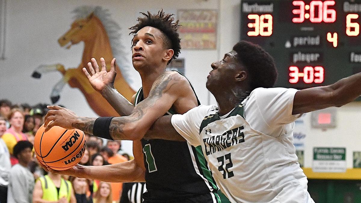 Myers Park’s Sadiq White Jr. protects the ball from Northwood’s Drake Powell (32) in the fourth quarter.