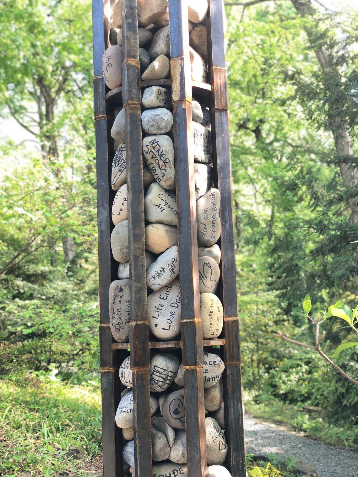 Remembrance Stones” is a memorial created by UNC Charlotte students and faculty as a symbol of solidarity in the aftermath of the school shooting that killed two students and wounded four others in April 2019. The memorial is in the university’s Botanical Gardens.