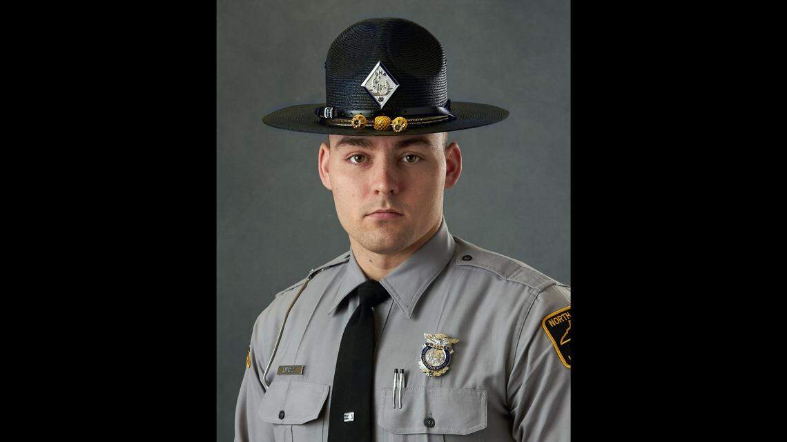 State Trooper K. L. Huss is credited with saving a woman and 5-year-old child from a burning vehicle in Catawba County.
