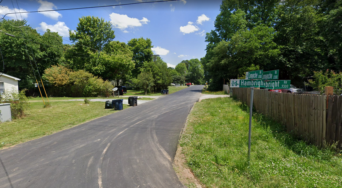 The view of the 12000 block of Comanche Road from Hambright Road in Huntersville, NC.