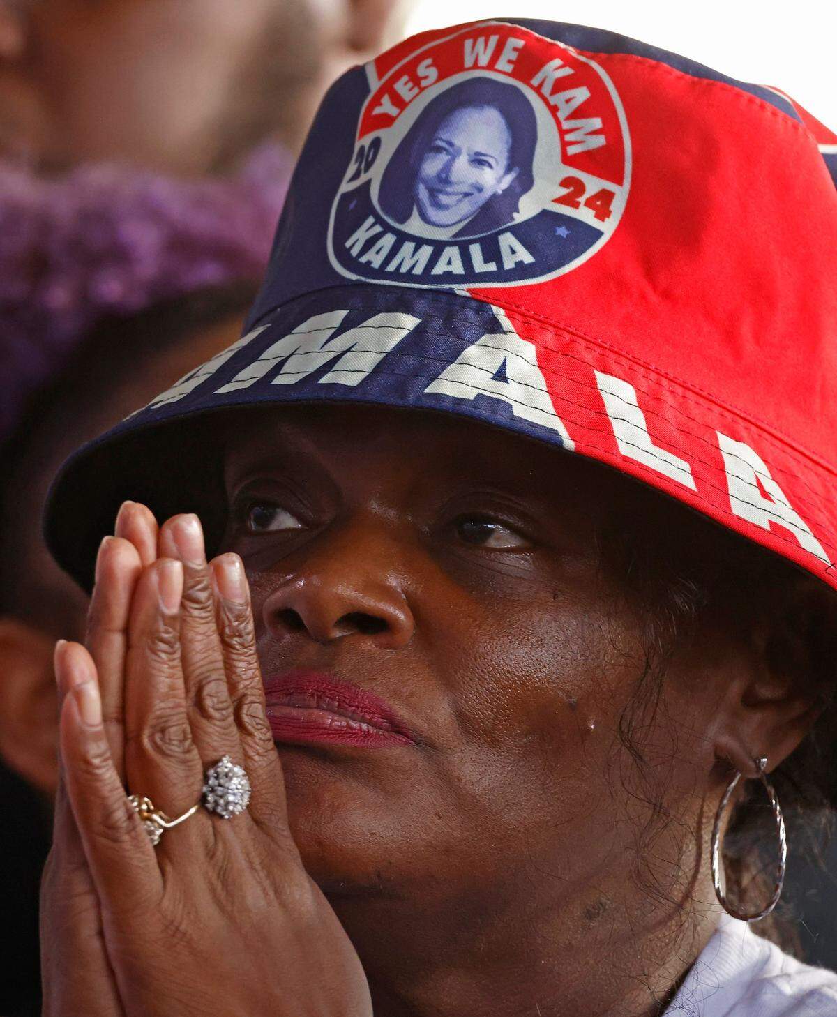 A supporter listens intently to Vice President and presidential candidate Kamala Harris during a “When We Vote We Win” rally at PNC Music Pavilion on Saturday, November 2, 2024.