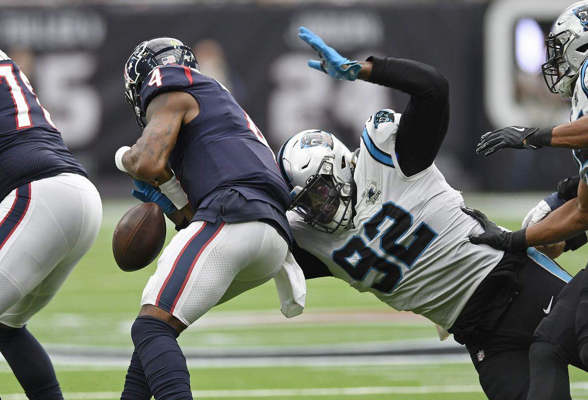 Carolina Panthers defensive tackle Vernon Butler (92) strips the ball from Houston Texans quarterback Deshaun Watson (4) as he sacks him Sunday. The play was good for a turnover and Carolina’s sixth and final sack of the game in a 16-10 Panthers win.
