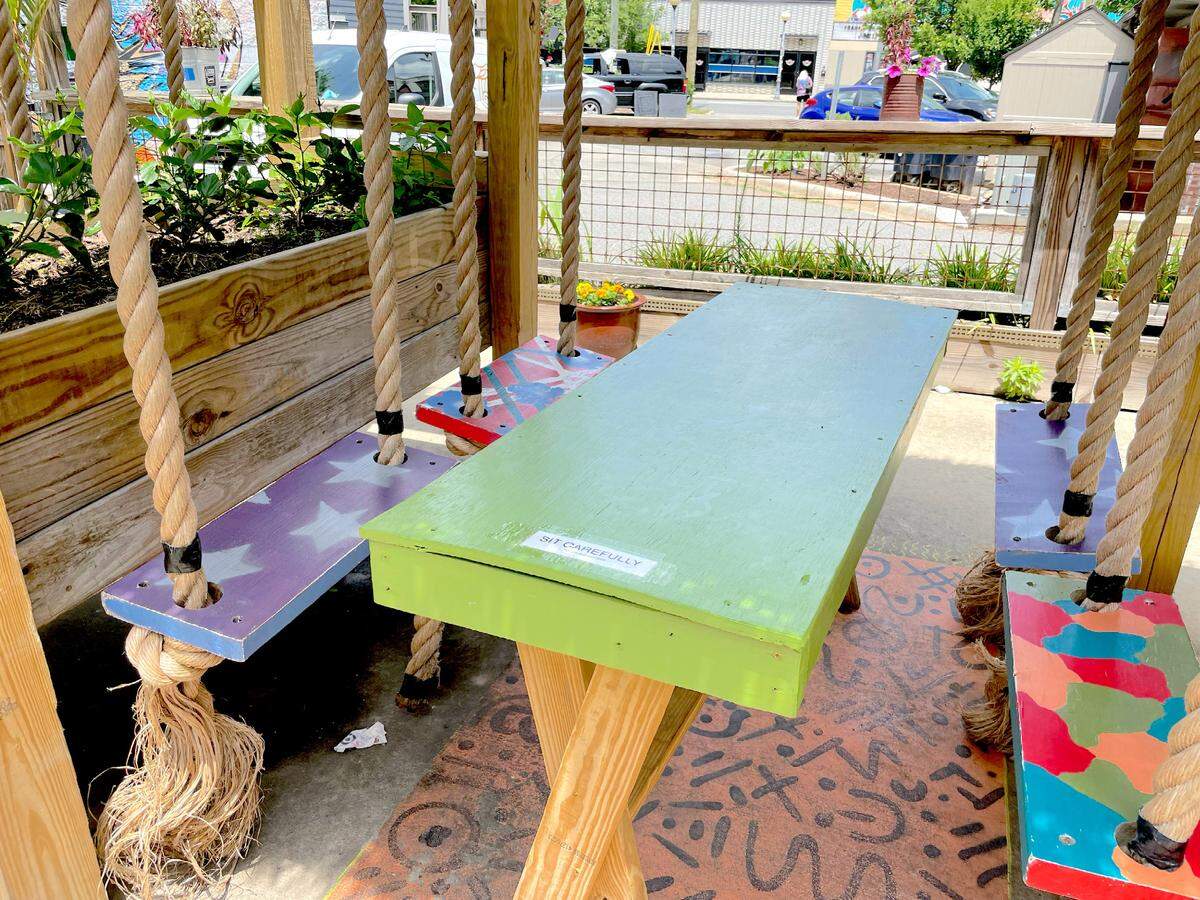 Drink a NoDa Colada while enjoying the swings on the NoDa Company Store’s patio.