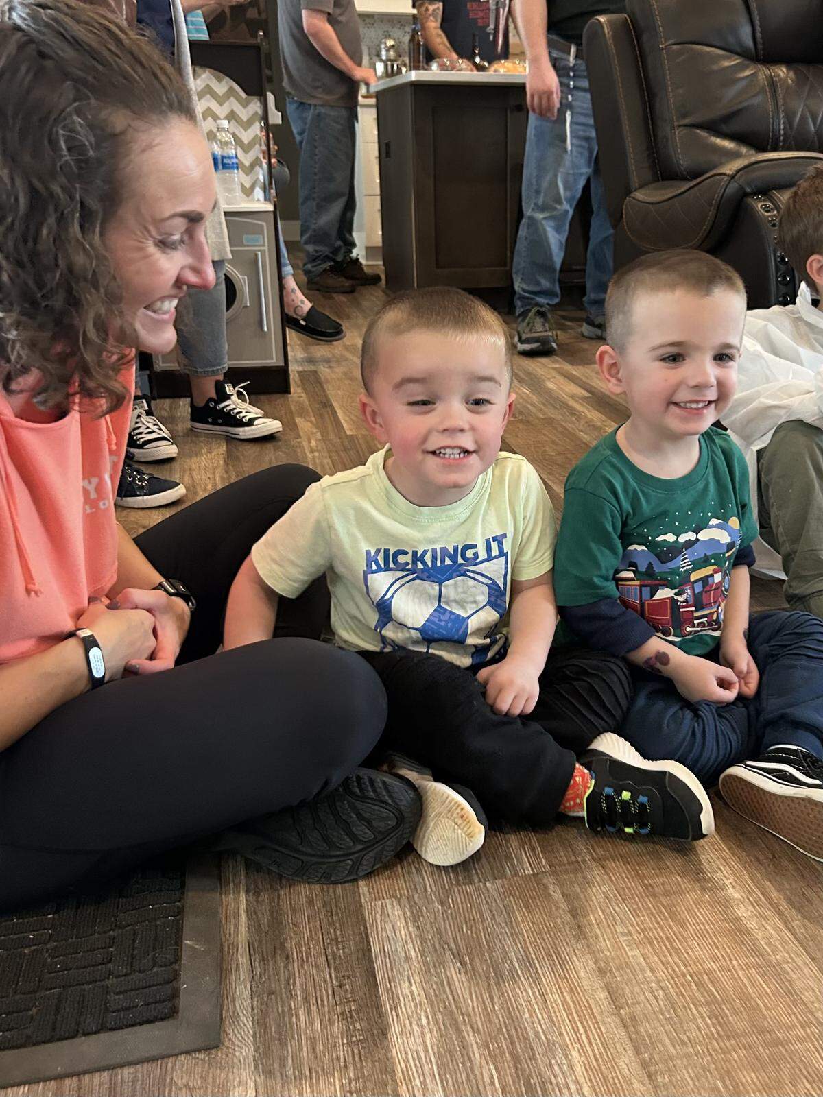 Stacy Reese with Logan, center, and RJ, at a party on the last day before Logan’s injury.