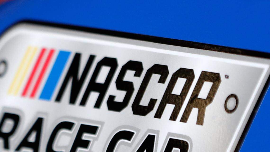 A NASCAR logo on a car is seen in the garage during a NASCAR auto racing practice session at Daytona International Speedway, Saturday, Feb. 10, 2018, in Daytona Beach, Fla. (AP Photo/John Raoux)