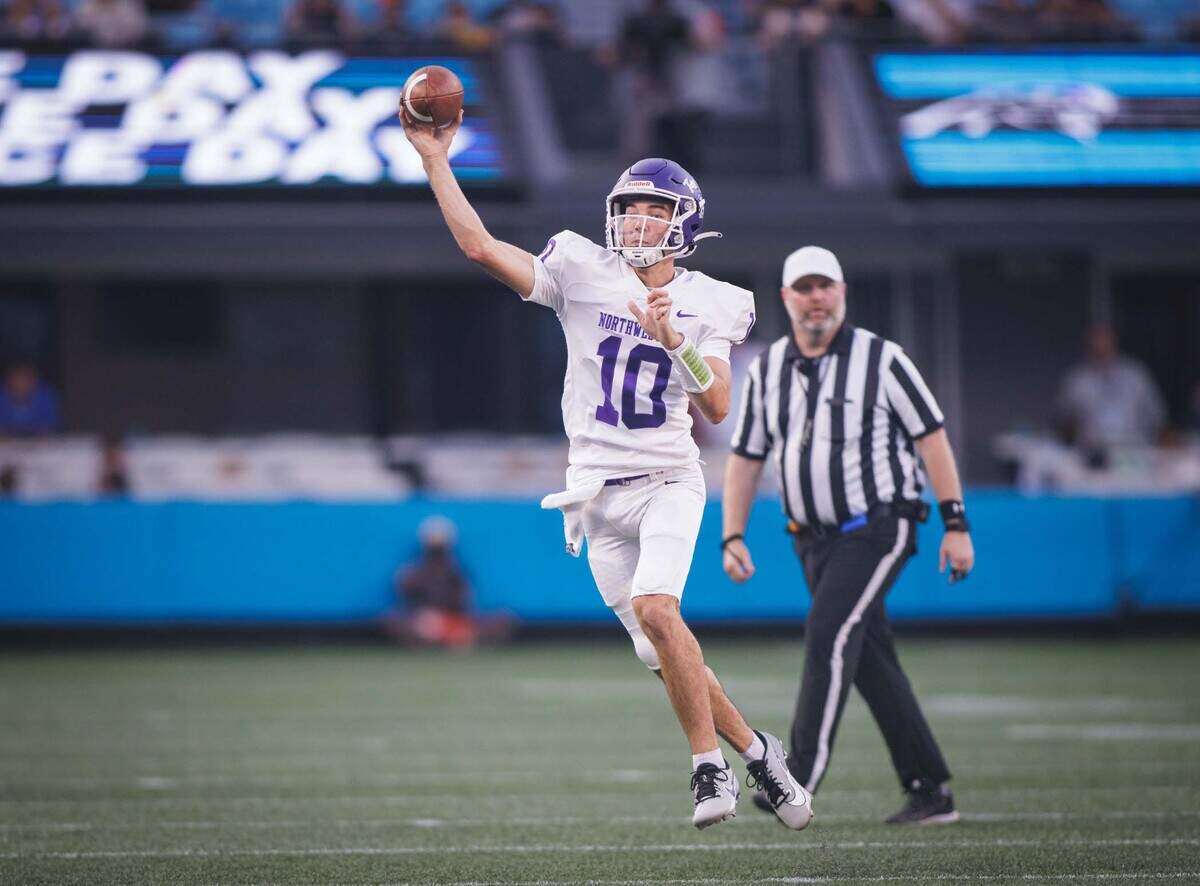 Northwestern quarterback Finley Polk (10) throws downfield in his team’s game against Providence Day Saturday in the Keep Pounding Classic at Bank of America Stadium.