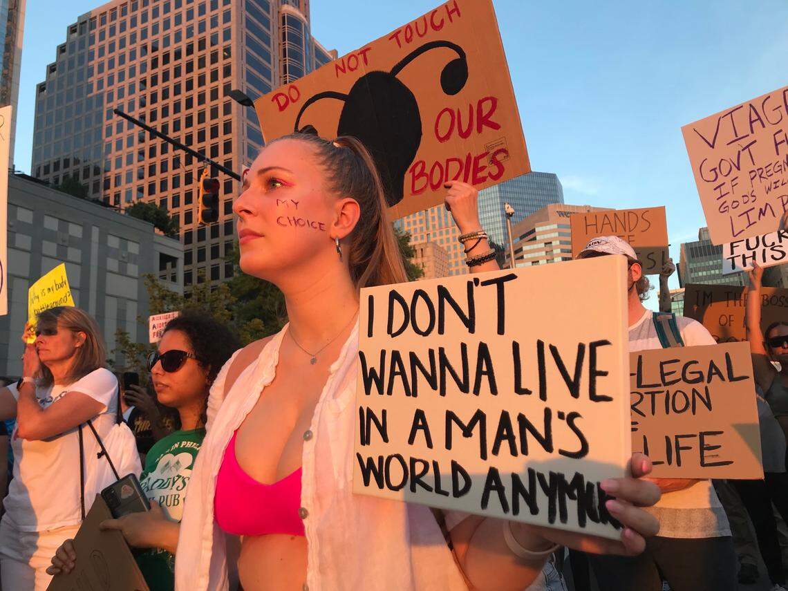 Demonstrators march through uptown Charlotte, N.C, on Friday, June 24, 2022, following a protest at the Charlotte-Mecklenburg Government Center to denounce the U.S. Supreme Court’s decision to overturn Roe v. Wade.