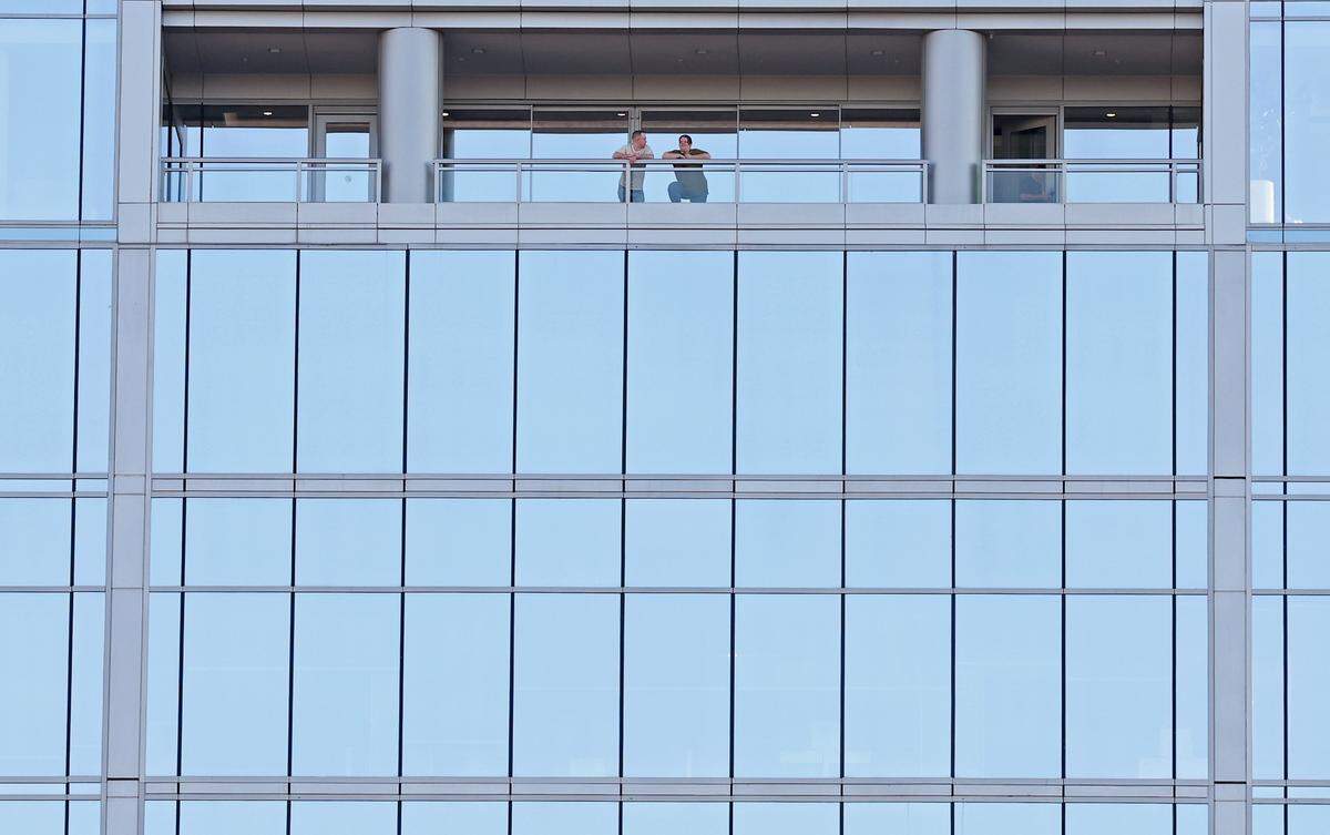 Spectators watch the Texas Tailgaters and Firefighters from a balcony of the FNB building on Thursday, June 4, 2026 Banana Ball action returned to the Queen City with the Texas Tailgaters battling the Firefighters at Truist Field.
