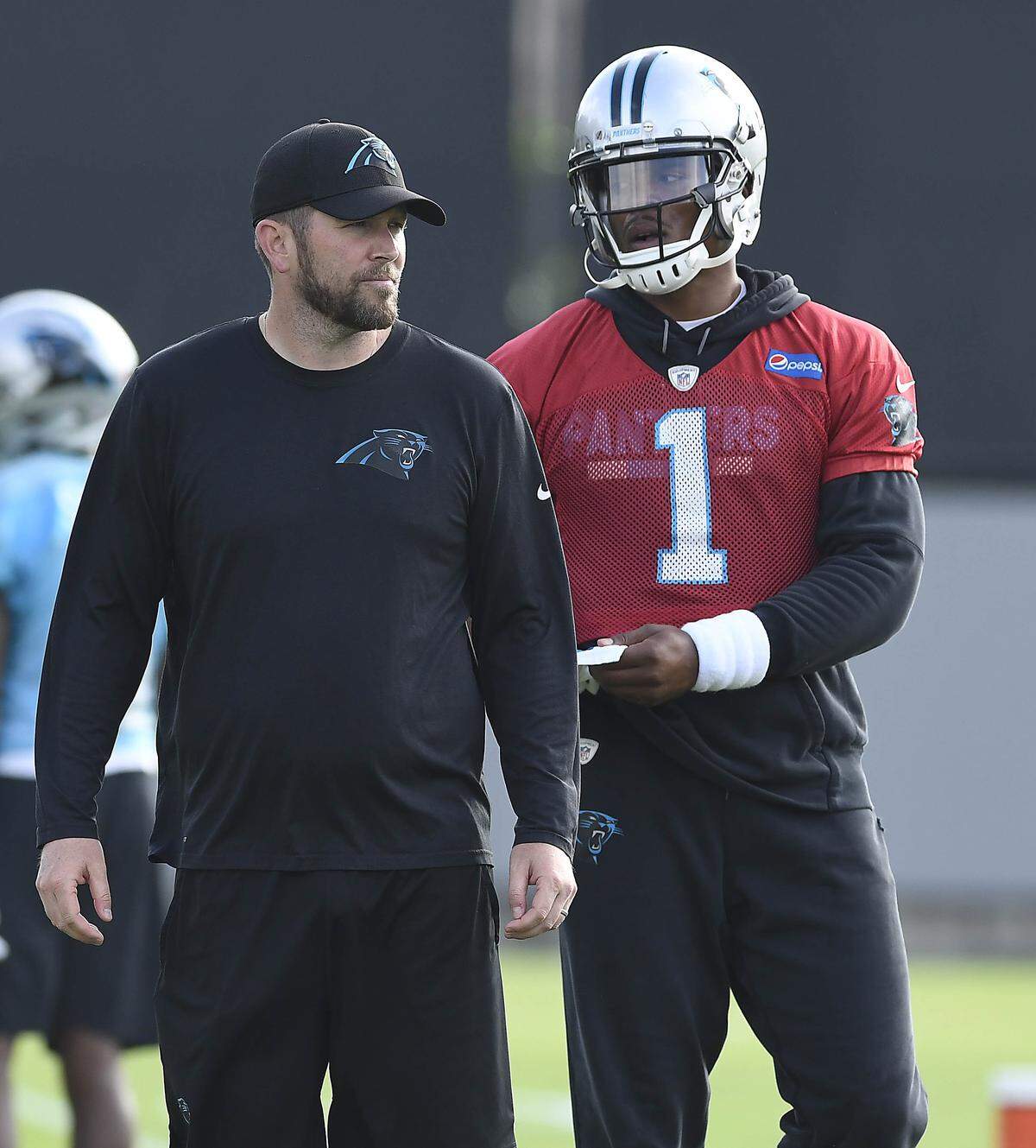 New quarterbacks coach Scott Turner was a Panthers offensive assistant in 2011 when Cam Newton, right, broke Peyton Manning's rookie passing record.