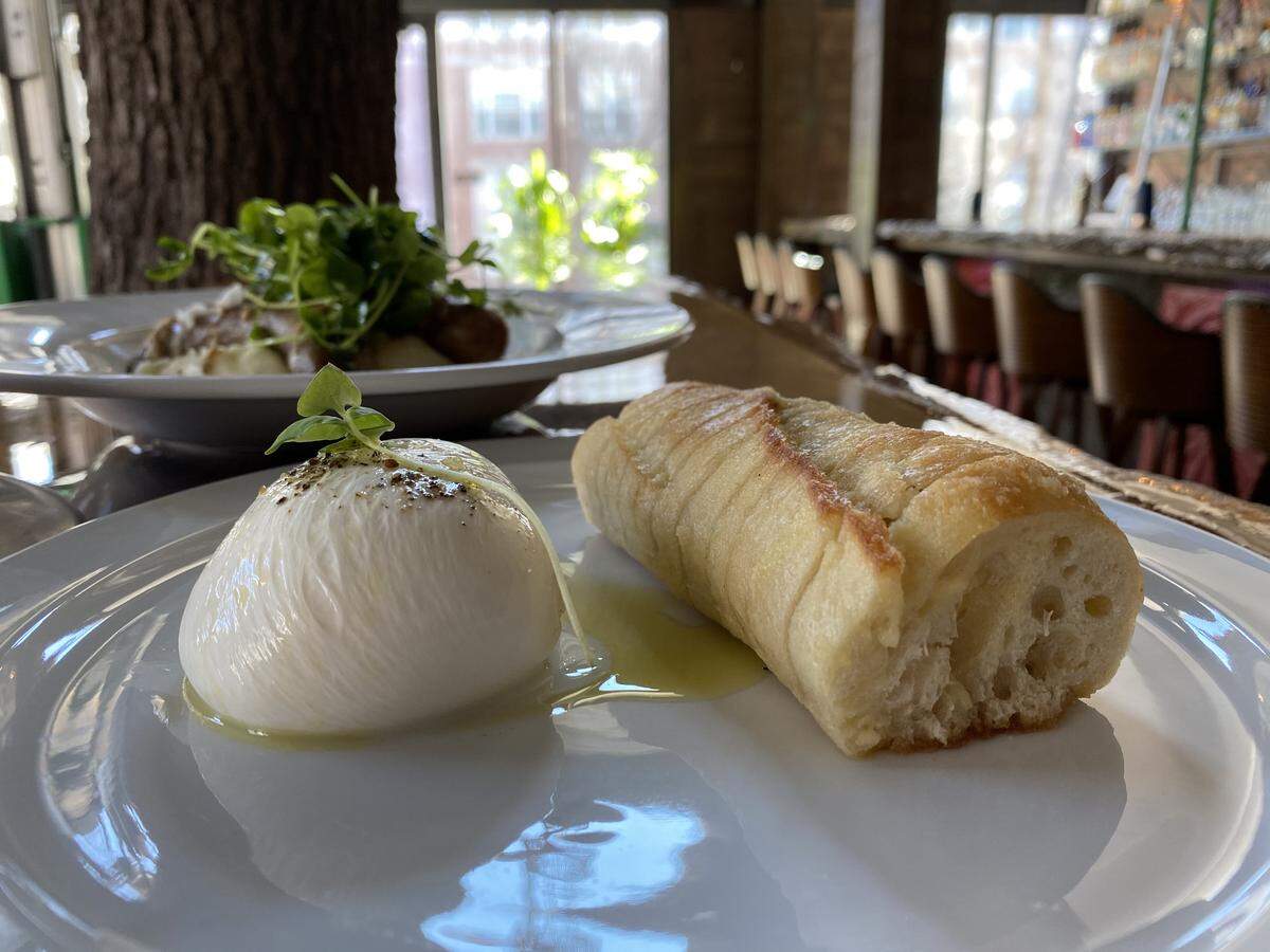 Burrata cheese, served with warm garlic bread, will be on the menu at Charlotte Beer Garden.