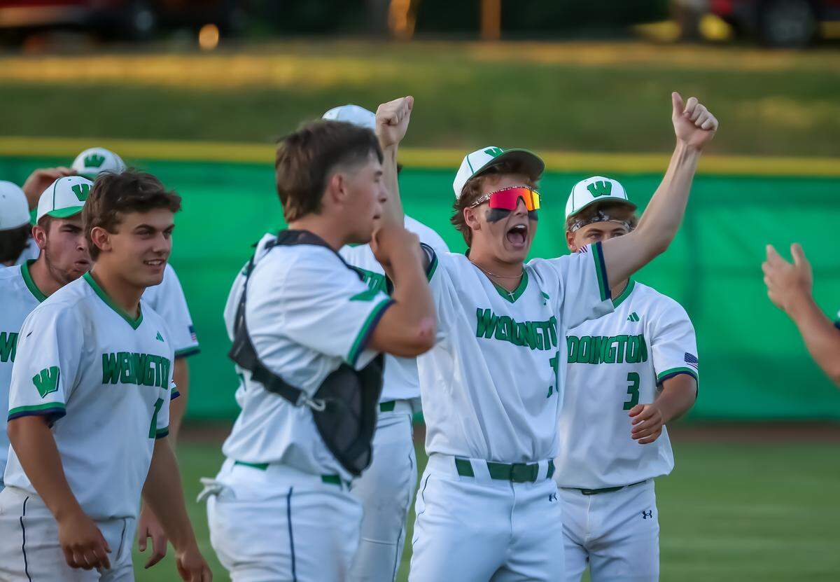 Jake Ciapmi throws his arms skyward as he runs onto the field celebrating a win over South Mecklenburg that sends the Weddington Warriors to the next round of the NCHSAA playoffs on May 6, 2026 at Weddington high school