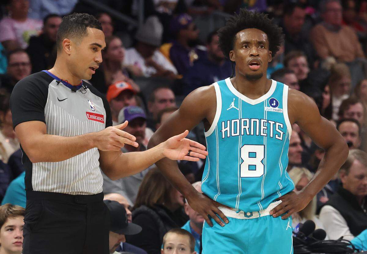 Charlotte Hornets guard Collin Sexton, right, listens to an official during action against the Los Angeles Lakers on Monday, November 10, 2025 at Spectrum Center in Charlotte, NC. The Lakers defeated the Hornets 121-111.