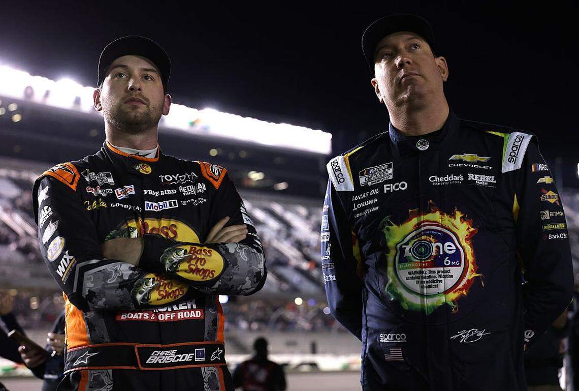 DAYTONA BEACH, FLORIDA - FEBRUARY 11: Chase Briscoe, driver of the #19 Bass Pro Shops Toyota, (L) and Kyle Busch, driver of the #8 zone Jalapeno Lime Chevrolet, look on during qualifying for the NASCAR Cup Series Daytona 500 at Daytona International Speedway on February 11, 2026 in Daytona Beach, Florida. (Photo by Kevin C. Cox/Getty Images)