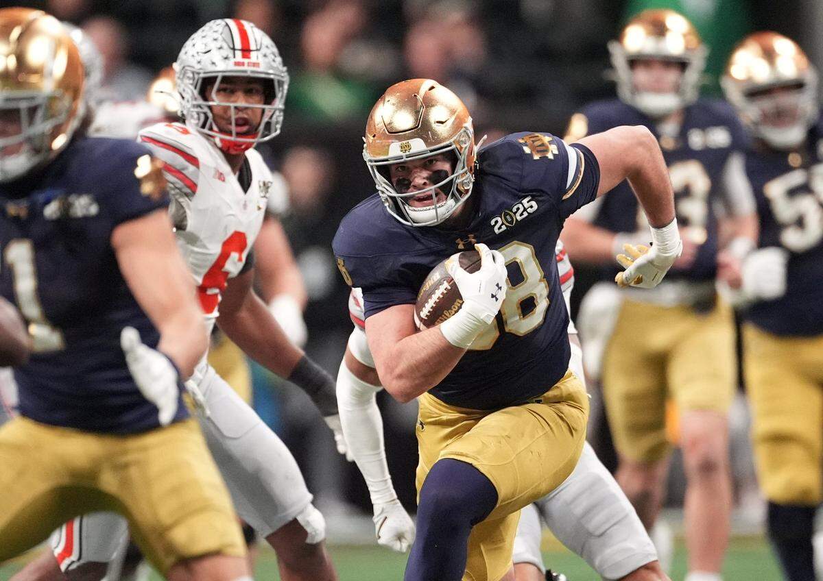 Jan 20, 2025; Atlanta, GA, USA; Notre Dame Fighting Irish tight end Mitchell Evans (88) runs after a catch against the Ohio State Buckeyes in the second half in the CFP National Championship college football game at Mercedes-Benz Stadium. Mandatory Credit: Dale Zanine-Imagn Images