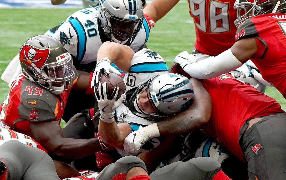 Panthers running back Christian McCaffrey stretches out for a touchdown on fourth-and-goal from the 1 to complete a 99-yard TD drive for Carolina.