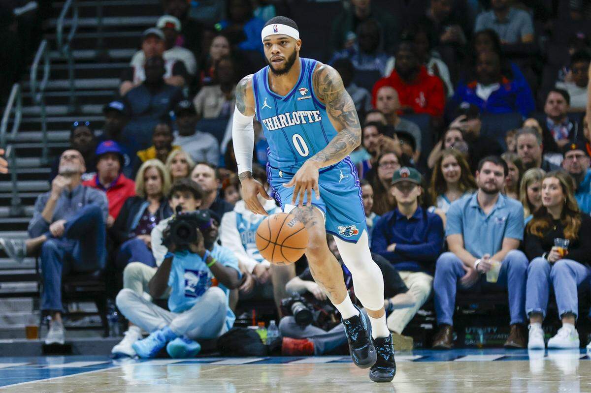 Charlotte Hornets forward Miles Bridges (0) brings the ball upcourt against the New York Knicks during the first quarter at Spectrum Center.