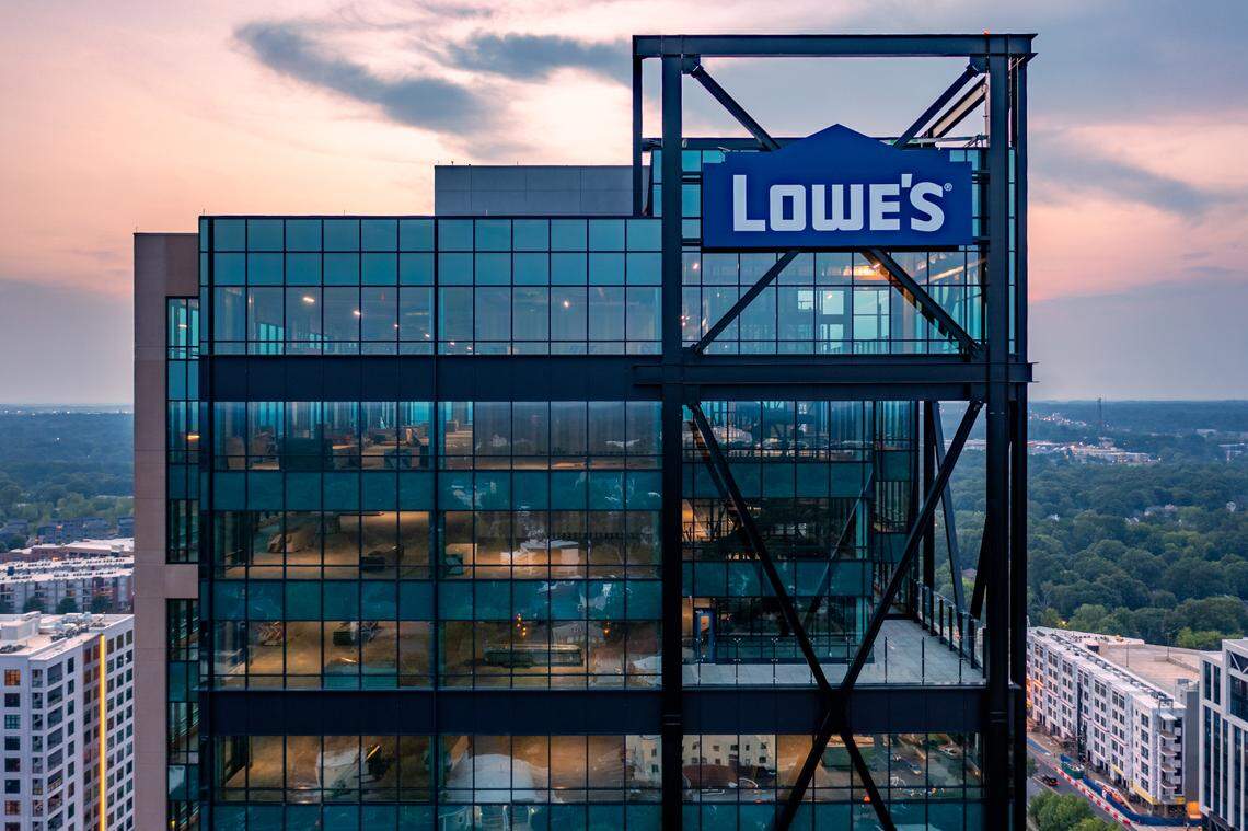 The sign for Lowe’s home improvement company was placed this month on the Design Center Tower at 100 W. Worthington Ave. in Charlotte. The opening of the tech center hub has been delayed until next year because of pandemic-related constraints, but hiring continues.