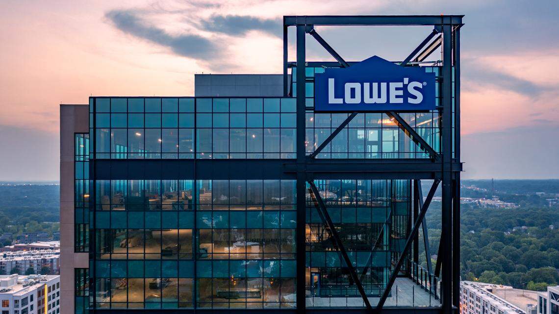The sign for Lowe’s home improvement company was place this month on the Design Center Tower at 100 W. Worthington Ave. in Charlotte. The opening of the tech center hub has been delayed until next year because of pandemic-related constraints, but hiring continues.