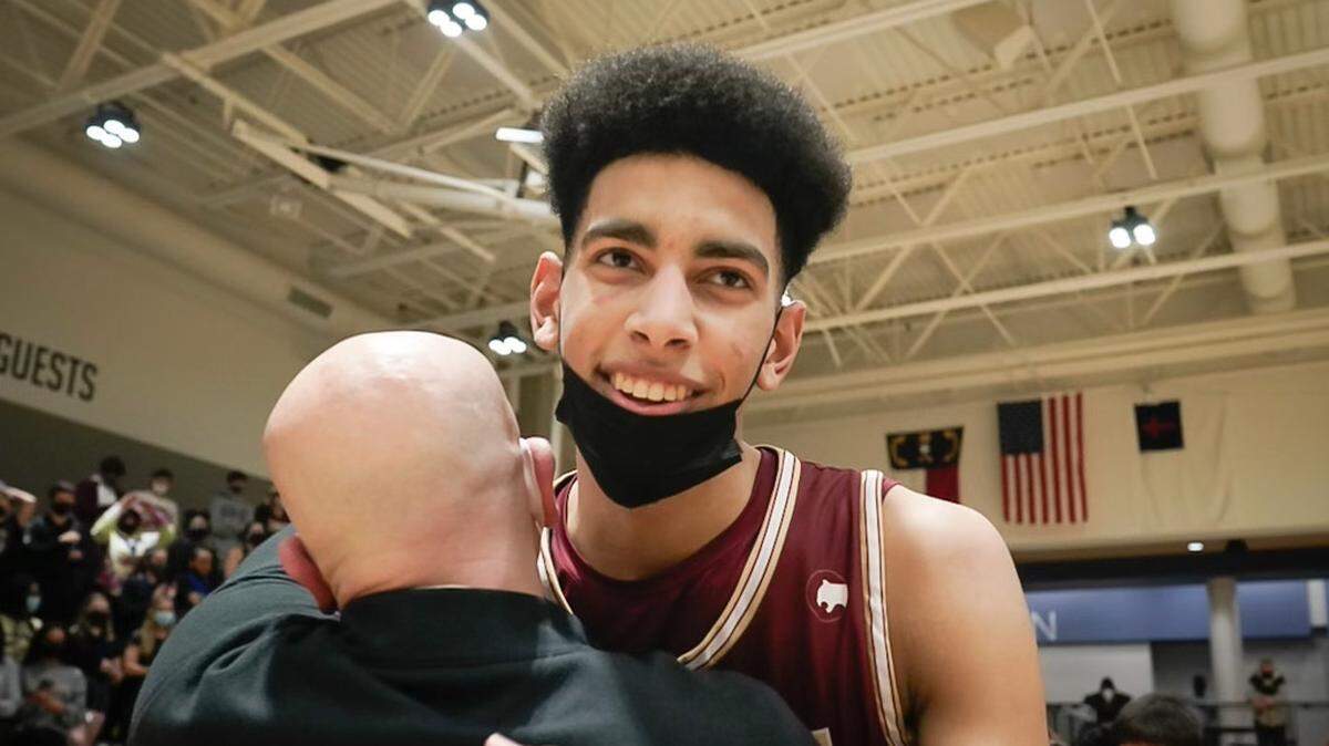 Christian Reeves hugs coach Che Roth after Cannon beat Carmel Christian in the NCISAA state finals Saturday