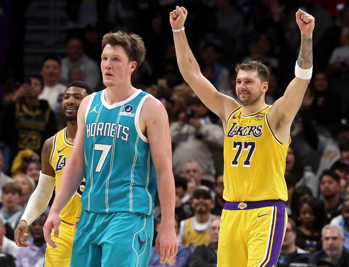 Los Angeles Lakers guard Luka Doncic, right, celebrates a basket by teammate and guard Austin Reaves in the closing moments of action against the Charlotte Hornets on Monday, November 10, 2025 at Spectrum Center in Charlotte, NC. The Lakers defeated the Hornets 121-111.