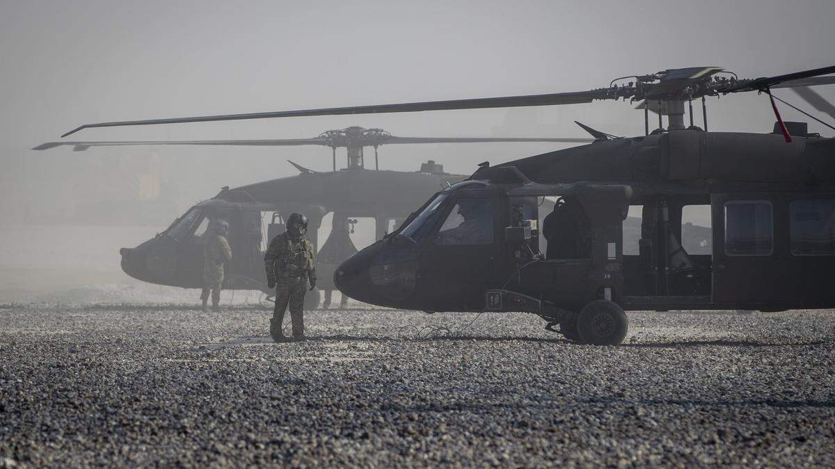 Federal prosecutors say a longtime FBI informant attempted to warn Islamic State operatives of a pending 2017 U.S. attack on an ISIS stronghold in Syria. In this AP file photo, Black Hawk helicopters are parked at a U.S. military base at undisclosed location in Eastern Syria, Monday, Nov. 11, 2019. 