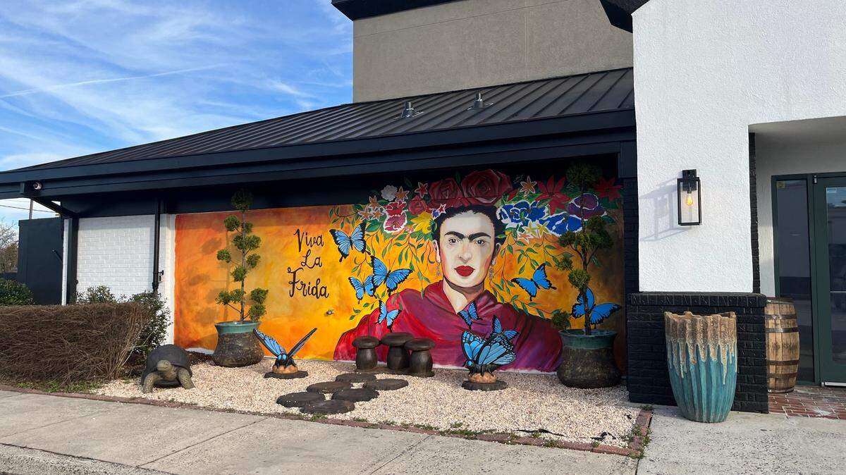A large mural of Mexican painter Frida Kahlo — created by Jorge Torres — decorates the wall outside Frida’s Mexican Cantina on Pineville-Matthews Road.