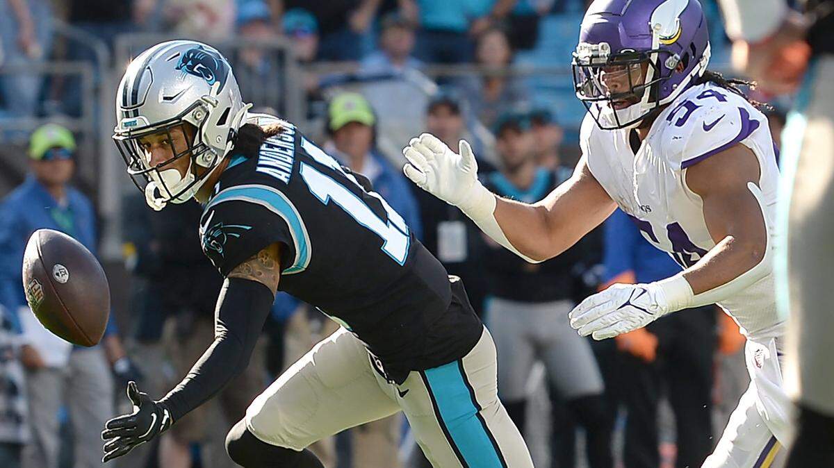 Carolina Panthers wide receiver Robby Anderson, left, is unable to catch a pass during the third quarter against the Minnesota Vikings on Sunday. Anderson dropped three passes in the loss.