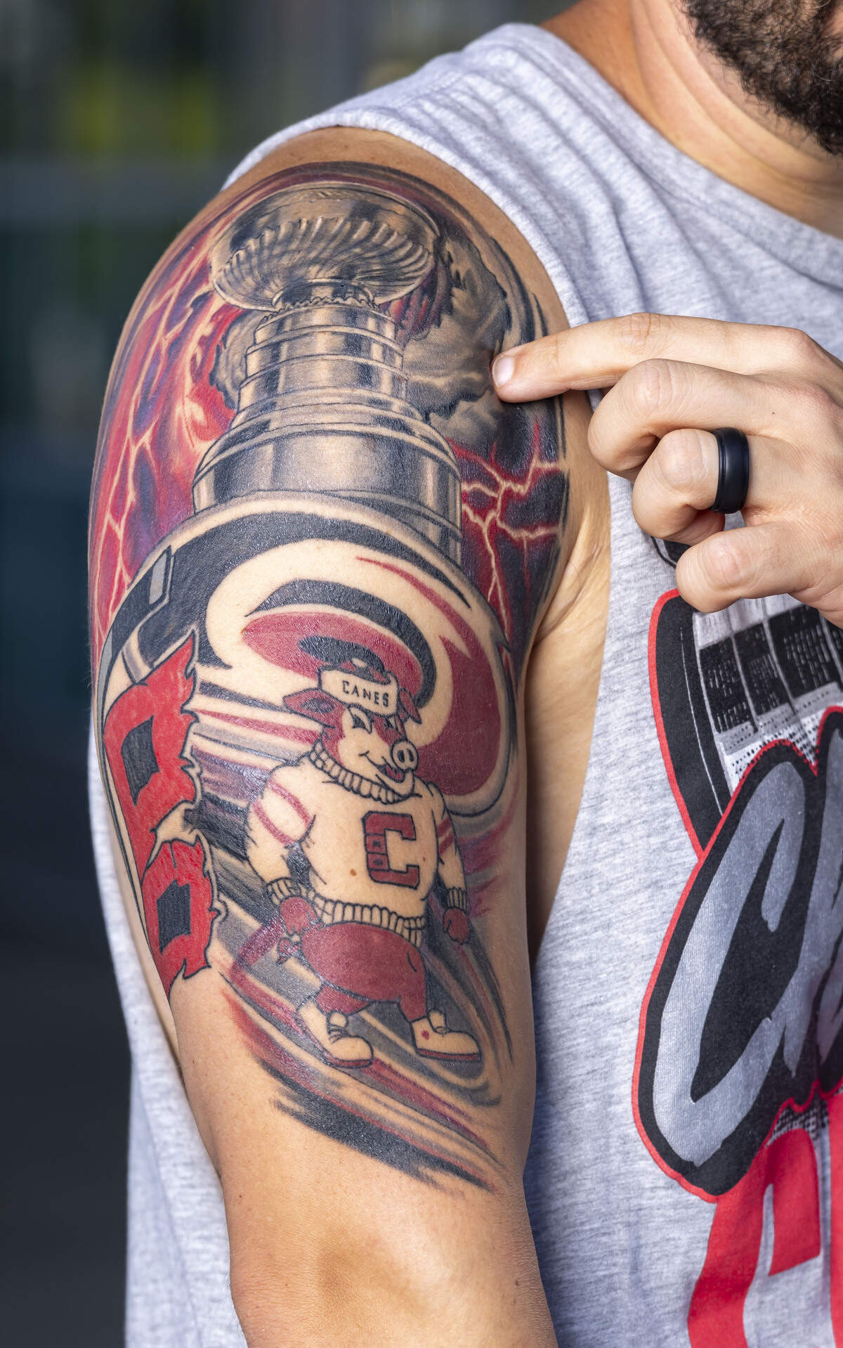 Bryson Karbley explains the evolution of the large tattoo celebrating the Carolina Hurricanes’ 2026 Stanley Cup championship on his right arm.