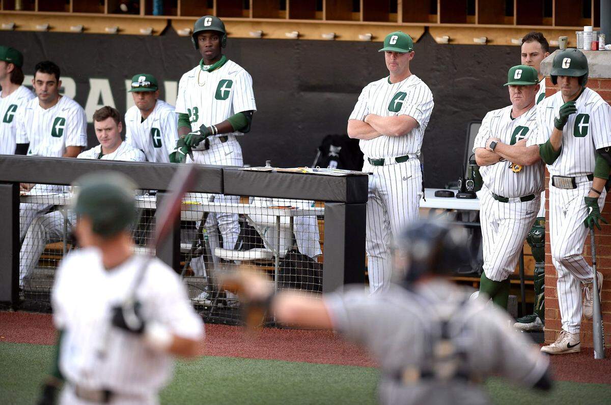 Charlotte 49ers head coach Robert Woodard, center, was one of seven new head coaches hired in the past three seasons by athletic director Mike Hill.