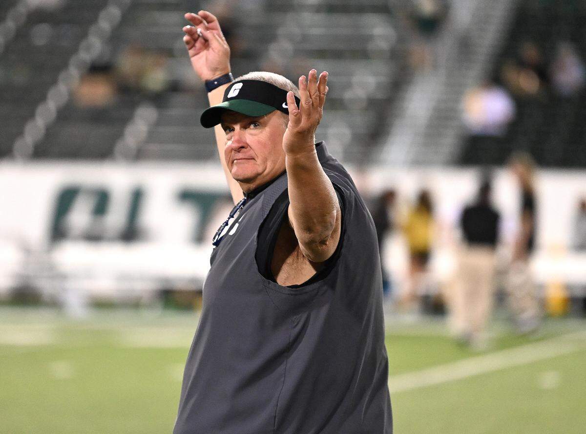 Charlotte 49ers head coach Biff Poggi turns and acknowledges the student section prior to action against Tulane on Thursday, October 31, 2024 at Jerry Richardson Stadium in Charlotte, NC.
