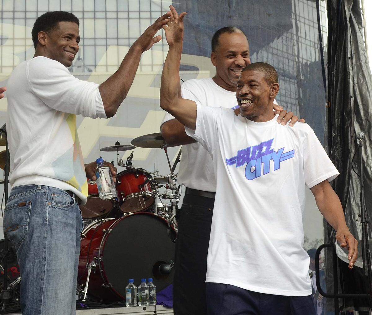 Hornets legends (from left) Kendall Gill, Muggsy Bogues and Dell Curry take the stage during the Buzz City Celebration at the Epicentre on Thursday, July 18, 2013.